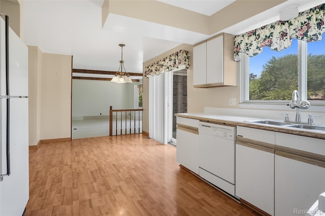 822 Keaton Dr, Troy, MI 48098 - kitchen featuring white appliances, light wood finished floors, white cabinets, and hanging light fixtures