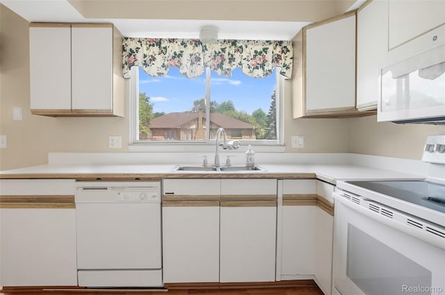 822 Keaton Dr, Troy, MI 48098 - kitchen with white appliances, plenty of natural light, white cabinetry, and light countertops