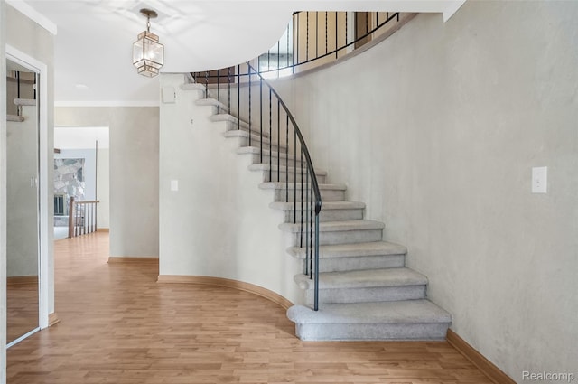 822 Keaton Dr, Troy, MI 48098 - stairway featuring wood finished floors and baseboards