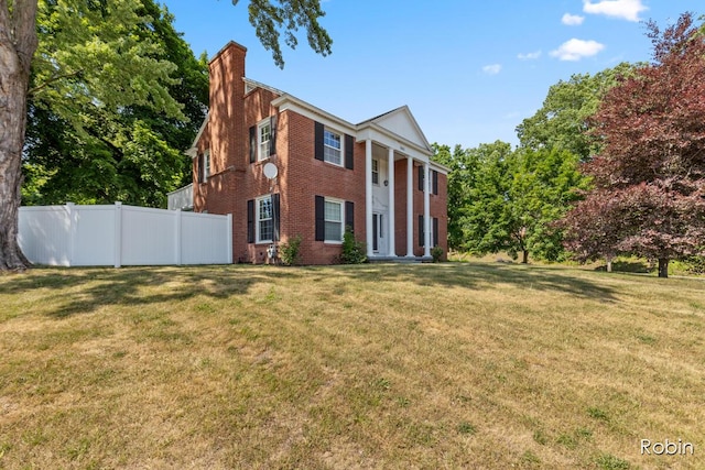 119 Bristol Ave NW, Grand Rapids, MI 49504 - view of front of house featuring a chimney and brick siding