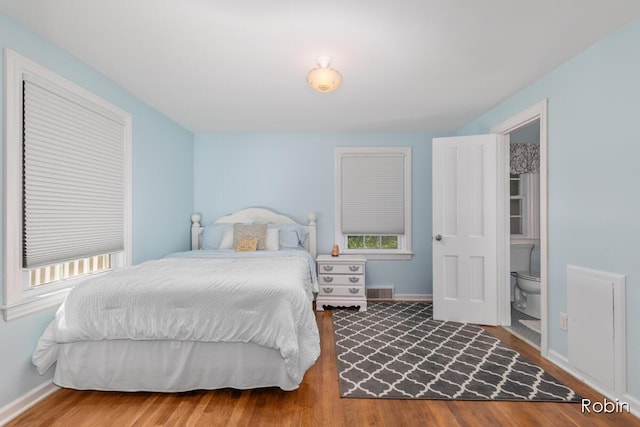 119 Bristol Ave NW, Grand Rapids, MI 49504 - bedroom with wood finished floors and multiple windows