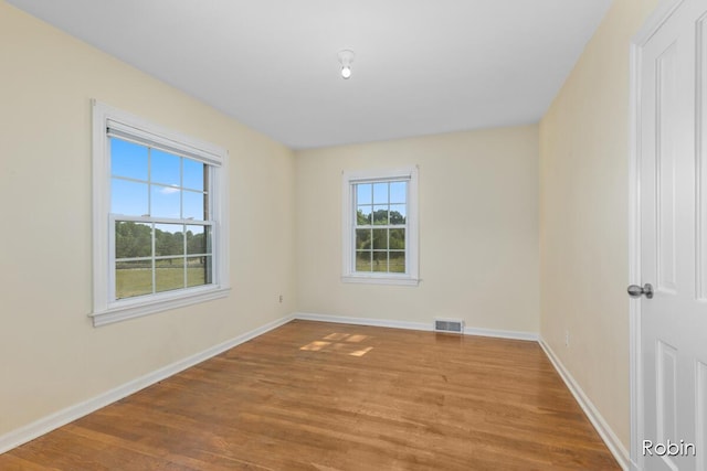 119 Bristol Ave NW, Grand Rapids, MI 49504 - empty room with wood finished floors and baseboards