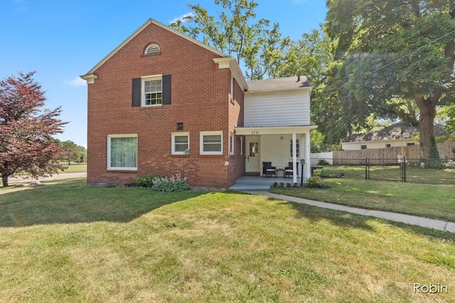 119 Bristol Ave NW, Grand Rapids, MI 49504 - rear view of property featuring brick siding and a patio area
