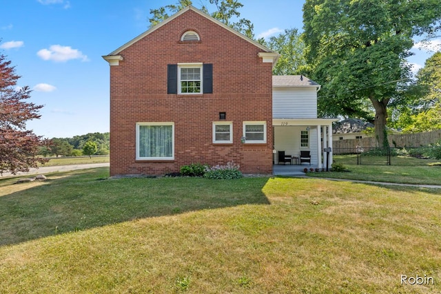 119 Bristol Ave NW, Grand Rapids, MI 49504 - back of house with a patio and brick siding