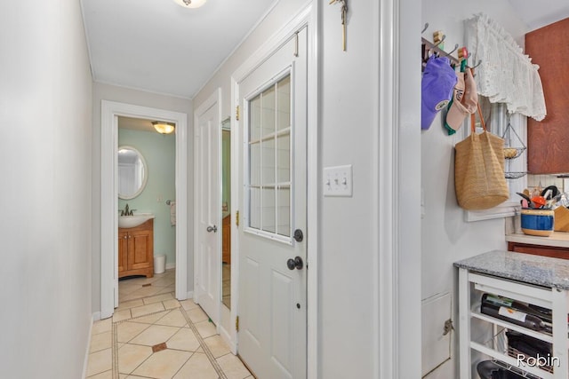 119 Bristol Ave NW, Grand Rapids, MI 49504 - corridor featuring light tile patterned floors and a sink