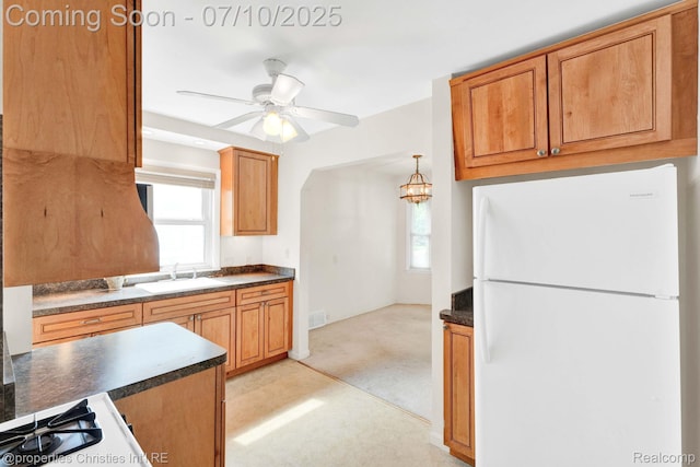 816 E 3rd St, Royal Oak, MI 48067 - kitchen featuring freestanding refrigerator, dark countertops, a ceiling fan, light colored carpet, and cooktop