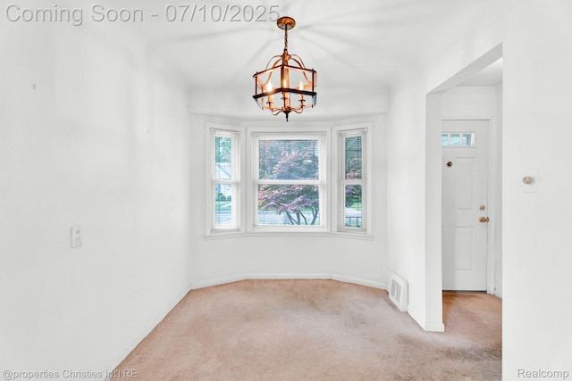 816 E 3rd St, Royal Oak, MI 48067 - empty room with carpet flooring and a chandelier