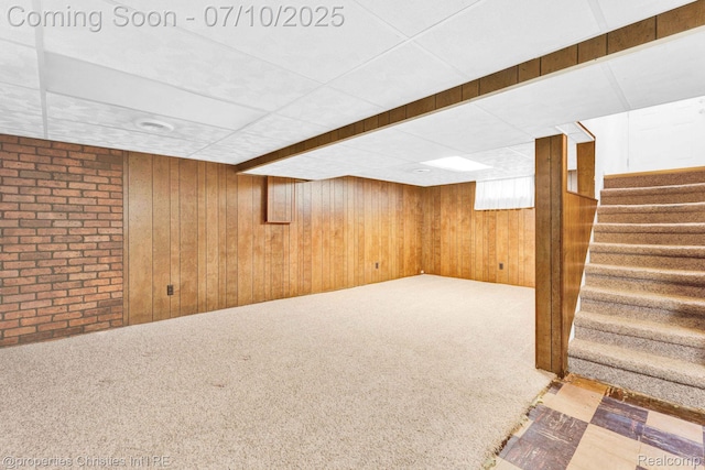 816 E 3rd St, Royal Oak, MI 48067 - finished below grade area with stairway, wood walls, carpet floors, and a drop ceiling