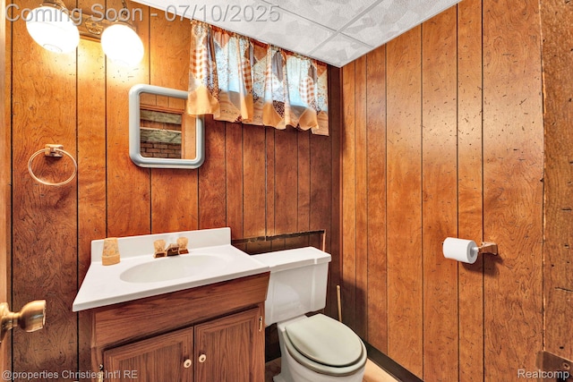 816 E 3rd St, Royal Oak, MI 48067 - bathroom featuring vanity and wood walls