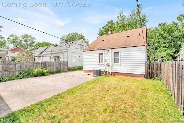 816 E 3rd St, Royal Oak, MI 48067 - back of property with a fenced backyard, a patio, and a chimney
