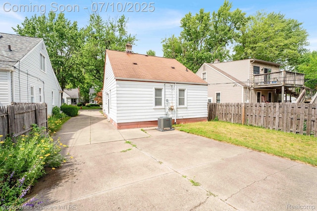 816 E 3rd St, Royal Oak, MI 48067 - rear view of property with a chimney, roof with shingles, and a patio area