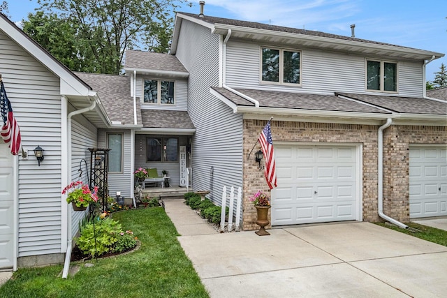 9379 Jamie Dr, Davison, MI 48423 - view of front of house featuring driveway, roof with shingles, and a garage