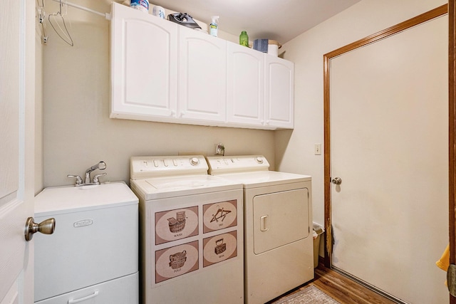 9379 Jamie Dr, Davison, MI 48423 - laundry room featuring washer and clothes dryer, cabinet space, and wood finished floors