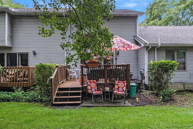 9379 Jamie Dr, Davison, MI 48423 - rear view of house featuring a wooden deck, a yard, and a shingled roof