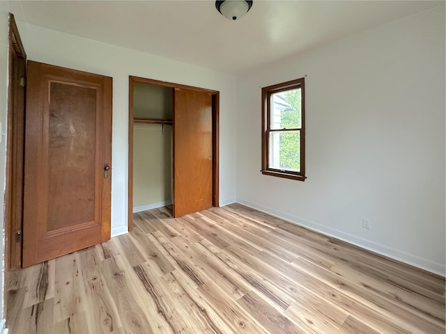 2839 128th Ave, Holland, MI 49424 - unfurnished bedroom featuring a closet and light wood-style flooring