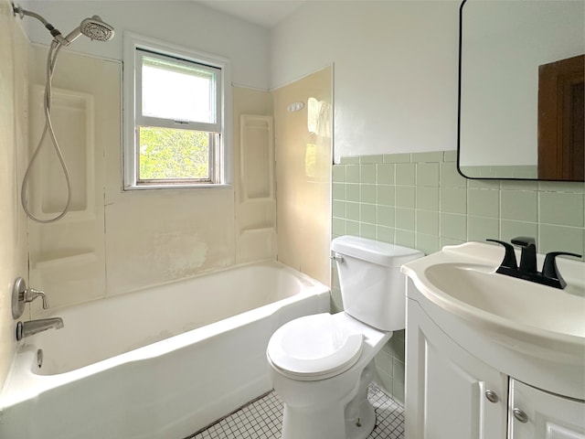 2839 128th Ave, Holland, MI 49424 - full bathroom featuring tile walls, vanity, tile patterned flooring, bathtub / shower combination, and wainscoting