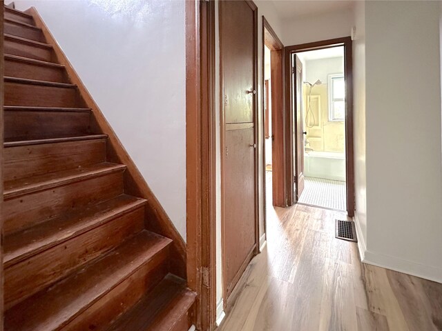 2839 128th Ave, Holland, MI 49424 - staircase featuring wood finished floors and baseboards
