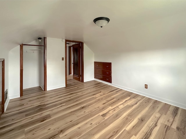 2839 128th Ave, Holland, MI 49424 - additional living space with wood finished floors and vaulted ceiling