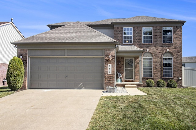 8767 Lilly Dr, Ypsilanti, MI 48197 - view of front of house with driveway, brick siding, a garage, a front lawn, and a shingled roof