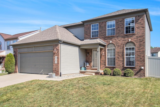 8767 Lilly Dr, Ypsilanti, MI 48197 - view of front of property with brick siding, driveway, a garage, and a front lawn