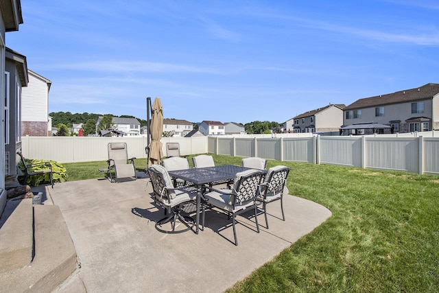 8767 Lilly Dr, Ypsilanti, MI 48197 - fenced backyard featuring a residential view, a patio, and outdoor dining area