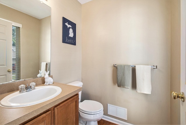 8767 Lilly Dr, Ypsilanti, MI 48197 - half bathroom with toilet and vanity