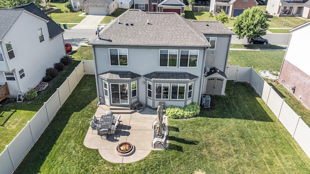8767 Lilly Dr, Ypsilanti, MI 48197 - rear view of house featuring a shingled roof, a residential view, and a patio area