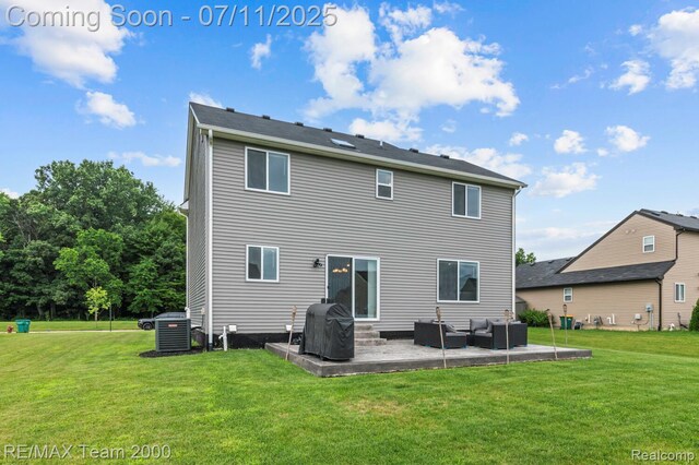 9019 Elbert Dr, Romulus, MI 48174 - back of house featuring an outdoor living space, a patio area, and a lawn