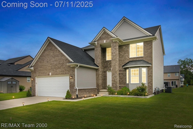 9019 Elbert Dr, Romulus, MI 48174 - traditional home featuring brick siding, a front lawn, and driveway