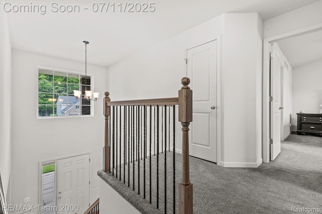 9019 Elbert Dr, Romulus, MI 48174 - stairs with a chandelier and carpet flooring
