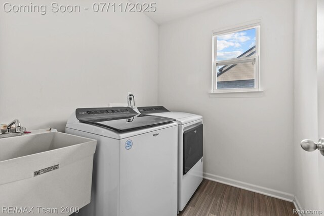 9019 Elbert Dr, Romulus, MI 48174 - washroom with washer and dryer and dark wood-type flooring