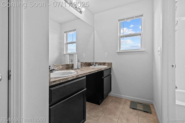 9019 Elbert Dr, Romulus, MI 48174 - full bath with double vanity and tile patterned floors
