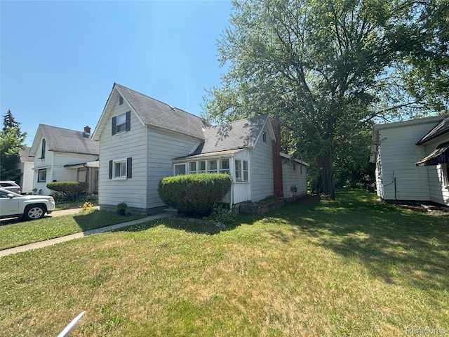 130 Meadle St, Warren, MI 48043 - view of property exterior featuring a lawn
