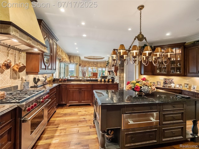 2756 Turtle Bluff Dr, Bloomfield Hills, MI 48302 - kitchen featuring custom range hood, luxury range, light wood-style floors, recessed lighting, and glass insert cabinets