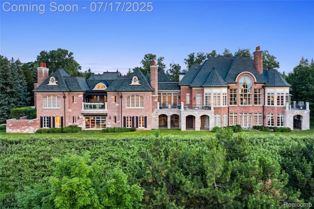 2756 Turtle Bluff Dr, Bloomfield Hills, MI 48302 - rear view of property with a balcony, a chimney, a high end roof, and brick siding