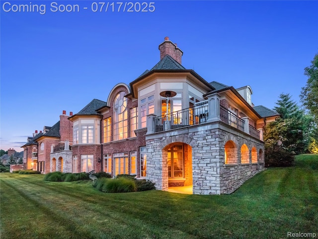 2756 Turtle Bluff Dr, Bloomfield Hills, MI 48302 - view of front of house with a balcony, a front lawn, stone siding, and a chimney