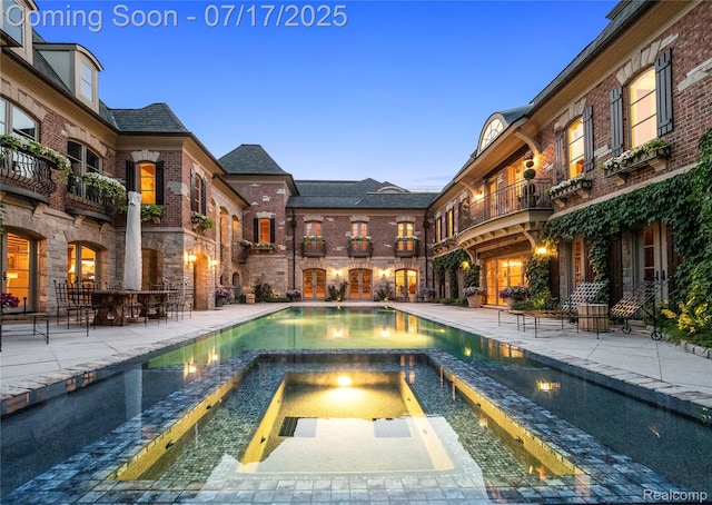 2756 Turtle Bluff Dr, Bloomfield Hills, MI 48302 - view of swimming pool with a patio area and a pool with connected hot tub