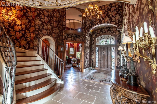2756 Turtle Bluff Dr, Bloomfield Hills, MI 48302 - tiled foyer featuring a towering ceiling, stairway, arched walkways, and a chandelier