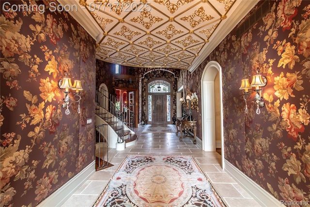 2756 Turtle Bluff Dr, Bloomfield Hills, MI 48302 - foyer with arched walkways, crown molding, stairway, and wallpapered walls