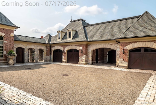2756 Turtle Bluff Dr, Bloomfield Hills, MI 48302 - french country home featuring brick siding, driveway, a high end roof, and stone siding