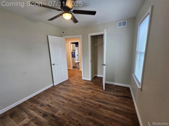 893 Leblanc St, Lincoln Park, MI 48146 - unfurnished bedroom featuring dark wood finished floors, multiple windows, a closet, and ceiling fan