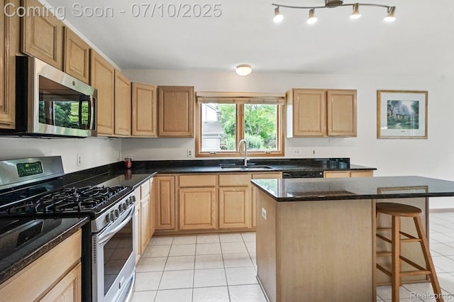 4253 Drexel Dr, Troy, MI 48098 - kitchen with appliances with stainless steel finishes, light tile patterned floors, a breakfast bar, a kitchen island, and light brown cabinets