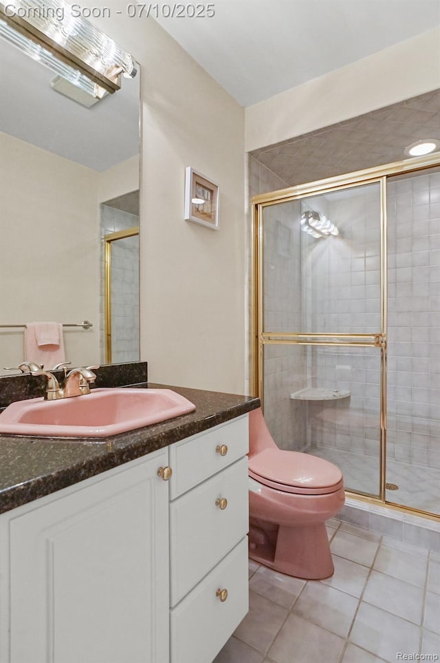 4253 Drexel Dr, Troy, MI 48098 - bathroom featuring tile patterned floors, vanity, and a stall shower