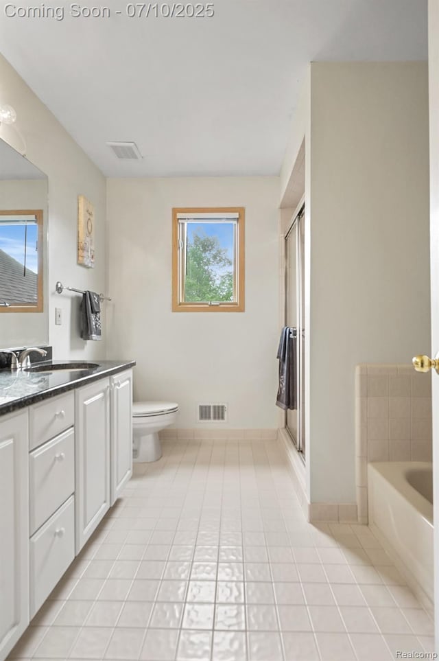 4253 Drexel Dr, Troy, MI 48098 - full bathroom featuring vanity, tile patterned floors, a garden tub, and a shower stall