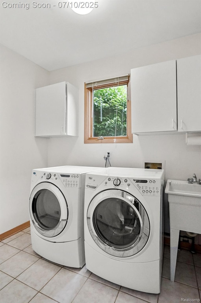 4253 Drexel Dr, Troy, MI 48098 - laundry room featuring cabinet space, independent washer and dryer, and light tile patterned floors