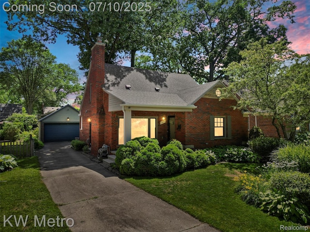 1877 Wiltshire Rd, Berkley, MI 48072 - view of front of home featuring an outbuilding, brick siding, a garage, and a chimney