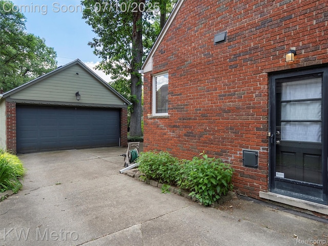 1877 Wiltshire Rd, Berkley, MI 48072 - view of home's exterior featuring brick siding, an outbuilding, and a detached garage