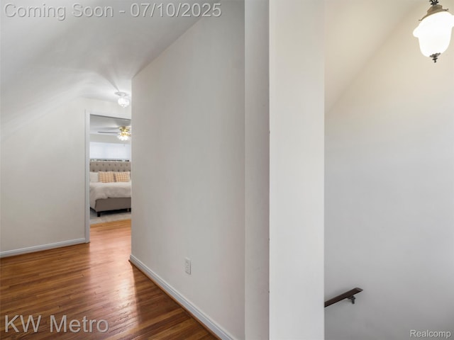 1877 Wiltshire Rd, Berkley, MI 48072 - corridor featuring wood finished floors, lofted ceiling, and an upstairs landing
