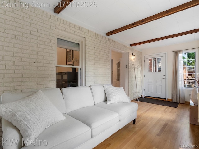 1877 Wiltshire Rd, Berkley, MI 48072 - living room featuring brick wall, beam ceiling, and wood finished floors