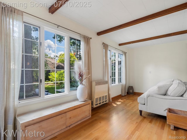 1877 Wiltshire Rd, Berkley, MI 48072 - sitting room featuring beamed ceiling, heating unit, and light wood-type flooring